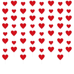 Detailed view of 3D red paper heart garland hanging vertically for wedding party decor
