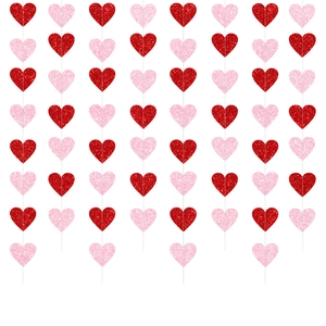 Close-up of glittery red and pink heart hanging garlands for Valentine party decor
