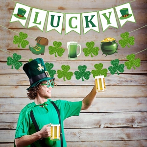 St. Patrick's Day party decorations with Lucky banner and glitter shamrock garlands