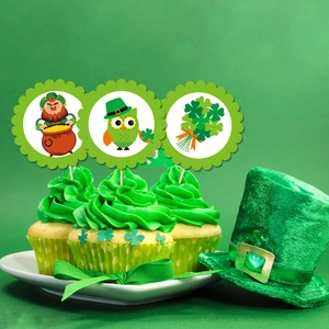 St. Patrick's Day leprechaun and shamrock cupcake toppers on green frosted party desserts