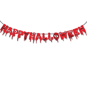 Macro detail of red bloody Happy Halloween banner with eyeballs and spiderweb motifs