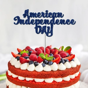 Blue glitter American Independence Day cake topper on a red velvet cake with berries