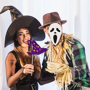 Halloween photo props featuring a purple wizard hat and a white scream mask with handles