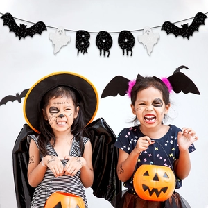 Halloween BOO banner with black glitter bats and white ghosts for festive party decor