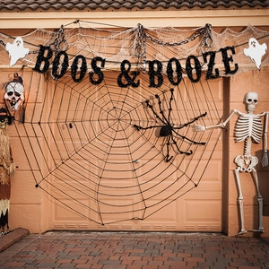 Halloween garage door decoration set with giant spider web and BOOS & BOOZE banner