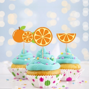 Orange fruit theme cupcake toppers on blue frosted cakes for birthday party decor