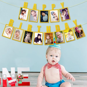 Glittery gold Happy Birthday photo banner with 13 cardstock frames for party decor