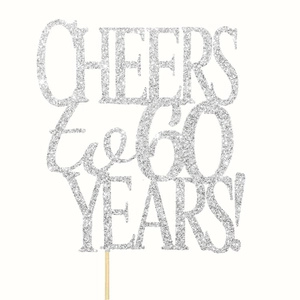 Macro shot of silver glitter cake topper featuring Cheers to 60 Years text on white background