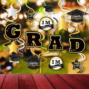 Graduation party decorations featuring black gold swirls and Congrats Grad hanging cards