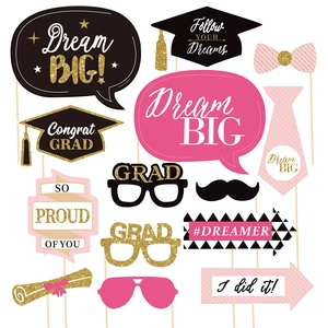 Glittering graduation photo booth props set with black, pink, and gold party decorations