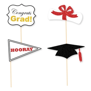 Graduation photo booth props with glitter congrats sign, diploma and mortarboard cap