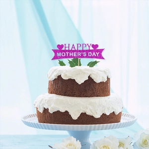 Pink glitter Happy Mother's Day cake topper with hearts on a chocolate cream cake