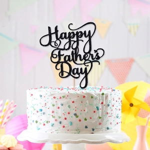Glittery Happy Father's Day cake topper centerpiece on white cake with party decor