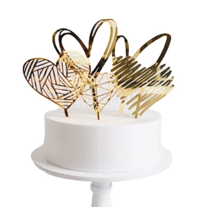 Mirror gold acrylic heart cake toppers with geometric patterns for wedding and birthday cakes