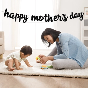 Black glittery Happy Mother's Day banner hanging in a cozy home with a family background