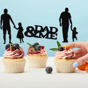Black glitter Father's Day cake toppers with family silhouettes on cupcakes