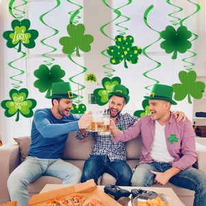 St. Patrick's Day party decorations with green clover hanging swirls and festive shamrock hats