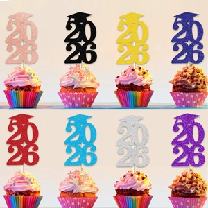 Close-up of 2026 graduation cupcake toppers in 8 glitter colors with mini mortarboards