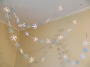Detail of blue and white 3D snowflake garland for Christmas home and party decor