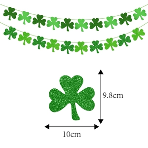 Saint Patrick's Day shamrock clover banner set with green glitter garland decorations