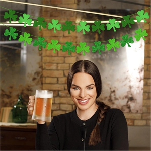 St. Patrick's Day shamrock garland with green felt and glitter clovers for party decor