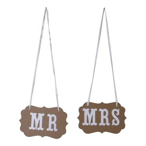 Wedding chair signs with MR and MRS lettering on brown cardstock with white ribbons