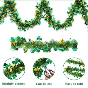 Close-up of St. Patrick's Day tinsel garland with green clovers and golden sparkles