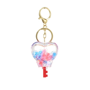Creative heart-shaped acrylic glitter keychain with pink and blue beads and golden clasp