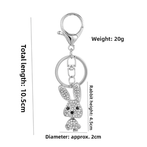Detailed view of silver rabbit keychain with rhinestones and size measurements