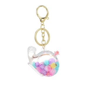 Colorful oil-filled whale helicopter keychain with vibrant bubble beads and golden clip