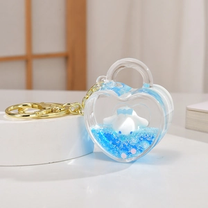 Porte-clés cœur en acrylique avec paillettes liquides bleues et figurine Cinnamoroll