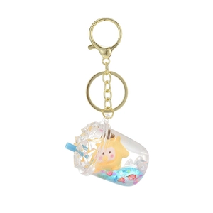 Cute acrylic liquid keychain with yellow cartoon figure and blue glitter in a tea cup