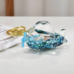 Creative airplane keychain with blue liquid quicksand and sparkling star sequins