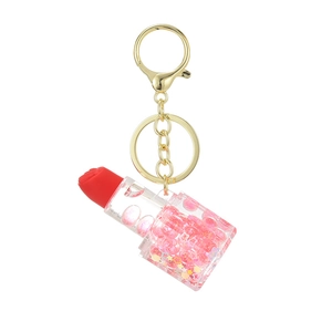 Porte-clés rouge à lèvres lumineux avec sable mouvant rose et anneau doré