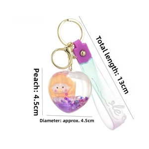 Detail of heart-shaped purple quicksand keychain with liquid and glitter stars 61g