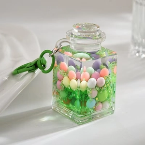 Detail of square drifting bottle keychain with colorful macaron beads and green clip