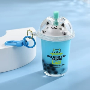 Blue bubble tea cup keychain with cute cat figurine and liquid quicksand effect