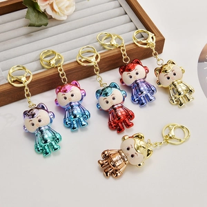 Porte-clés astronaute avec oreilles de chat aux reflets métallisés et couleurs dégradées