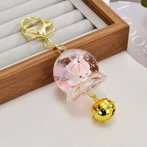 Porte-clés cloche à sables mouvants roses avec lapin blanc et anneau en métal doré