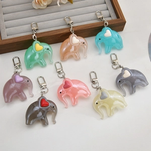 Set of eight colorful acrylic elephant keychains with heart details and metal clips
