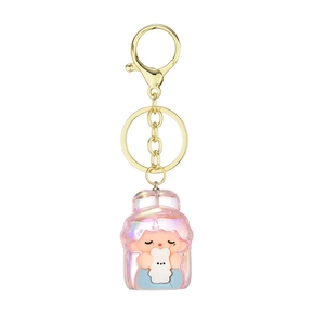 Iridescent acrylic cartoon girl keychain with bear charm on a clean white background