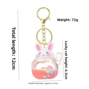 Detailed view of creative unicorn liquid keychain with pink oil and macaron beads