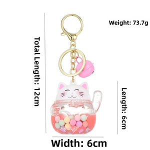 Close-up of lucky cat liquid keychain with colorful beads and pink bell charm detail