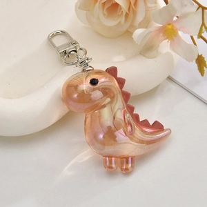 Detail of colorful acrylic dinosaur keychain with iridescent plating and metal carabiner