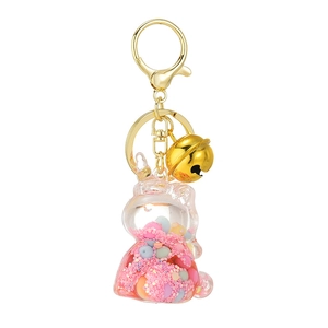 Cute bunny liquid quicksand keychain with pink glitter and colorful beads in acrylic