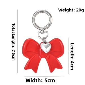Red acrylic bow keychain dimensions 5x4cm with silver heart charm and spring clasp