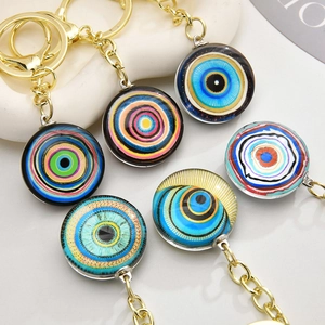 Detail of 6-piece evil eye keychain set with colorful glass charms and golden rings