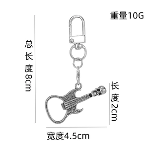 Detail view of silver skull guitar keychain with precise dimensions and weight