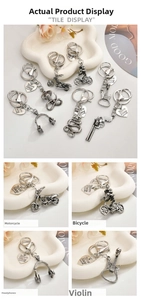 Detailed macro view of vintage zinc alloy charms including motorcycle and skull designs