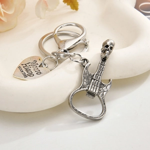 Punk guitar skull keychain bottle opener in vintage metal finish with heart tag
